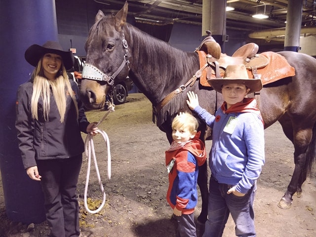 Kids petting a horse